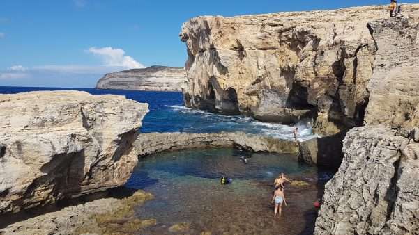 Divers emerge from the Blue Hole, diving on Gozo