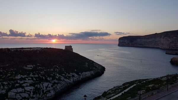Sunset behind Xlendi Tower